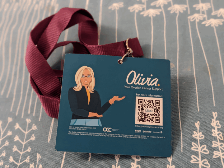 Kuva konferenssilätkän taustalla olevasta Olivia-sivuston mainoksesta